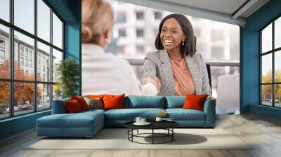 Were assembling a team of enterprising women. Shot of a young businesswoman shaking hands with a fellow staff member. Wall mural