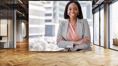 Portrait, smile and business with black woman, arms crossed and happiness with confidence, financial advisor and career ambition. Face, city background or employee with investor, accounting or broker Wall mural