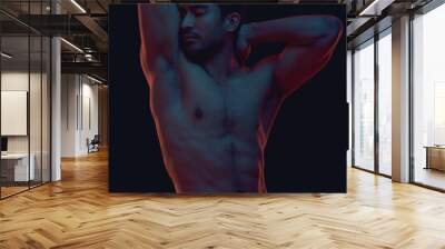 Erotic, nude and body of a sexy Asian man in dark light isolated on a black background. Seductive, art and strong naked Japanese model flexing for sensuality, desire and creativity on a backdrop Wall mural