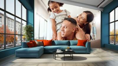 Family, children and playful with a girl, mother and father bonding on a sofa in their home together. Kids, love and living room with a man, woman and daughter playing together in their house Wall mural