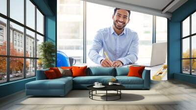 I can make these my own. Shot of a young male architect working in an office. Wall mural