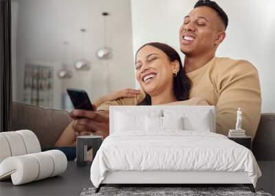 Phone, happy and couple on a social media meme internet page or website online laughing at funny content. Smile, subscription and young woman loves bonding and streaming comedy with partner at home Wall mural