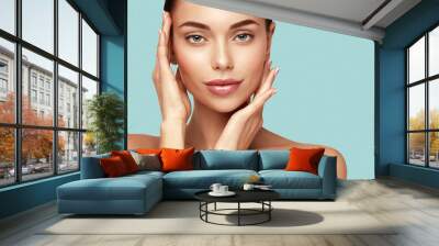 Skin care,Beauty treatment and spa concept. Attractive model with brown hair and  Clean Fresh Skin touch own face Wall mural