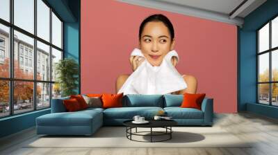 Young beautiful asian model cleaning skin with towel after washing, face portrait. Wall mural