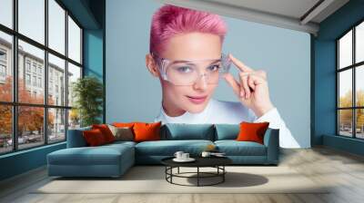 Lady beauty chemist professional wear protective transparent goggles developing innovation solution anti age product Wall mural