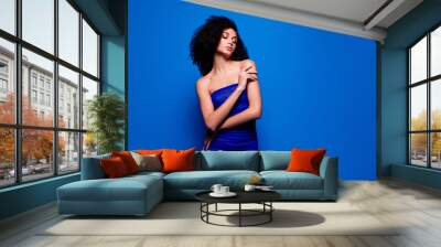 Photo of pretty lady girl touch hand look stand empty space isolated blue color background Wall mural