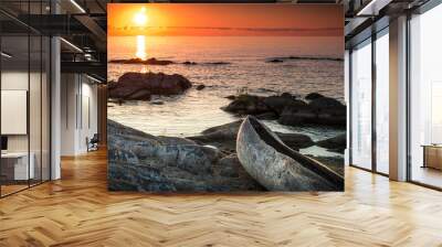 sunrise view at the Lake Malawi, waves rolling smoothly on the beach, wooden one tree boat in the foreground, Africa, Panorama Wall mural