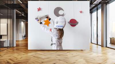 kid with a hand made galaxy at home Wall mural