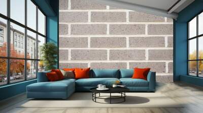 A new grey brick wall for a texture and patterned background. Wall mural