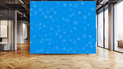 Light blue snowflakes seamless pattern on blue Christmas background. Chaotic scattered light blue snowflakes. Classy Christmas creative pattern. Vector illustration. Wall mural