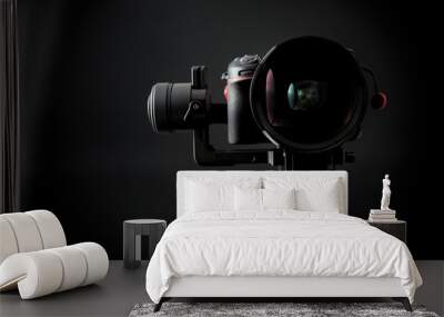 close-up of gimbal stabilizer, and dsl camera with low-key lighting and a black background Wall mural