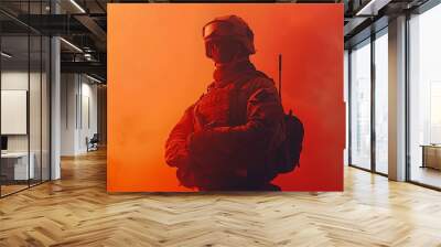 A determined soldier stands at attention, clad in military gear, prepared for battle. His expression reflects unwavering courage and readiness for the challenges ahead Wall mural