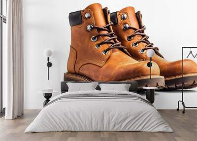 A stylish pair of leather boots on a white background with room for text on the side Wall mural