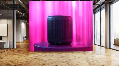 A wireless speaker placed on a vibrant neon background, providing ample room for copy text Wall mural