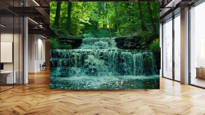 Defocused waterfall in lush green forest Wall mural