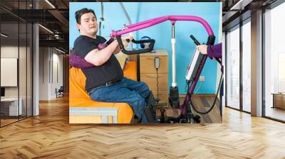 Young man with infantile cerebral palsy. Wall mural