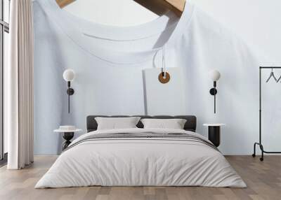  White t-shirt with blank price tag on wooden hanger Wall mural