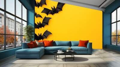 black bat decorations on a bright yellow background, with copy space for text Wall mural