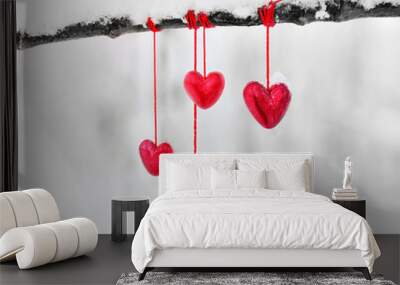 Red hearts on snowy tree branch in winter. Holidays happy valentines day celebration heart love concept. Wall mural