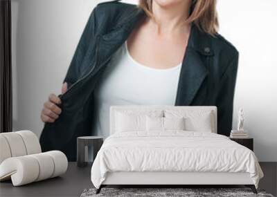 Young beautiful girl in a leather jacket isolated on white backg Wall mural