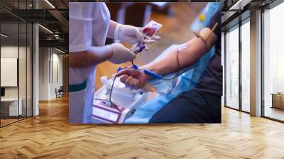 Blood donation hand. Nurse hands Wall mural