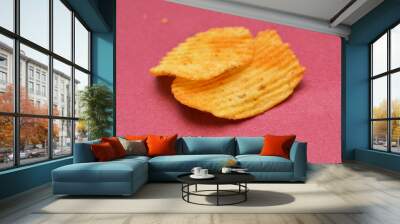 potato chips spiced with hot chili pepper on red background, Wall mural