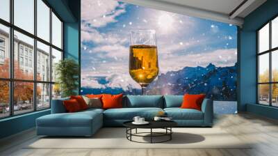 Glass of beer with the Serre Chevalier Alps in the background, France Wall mural