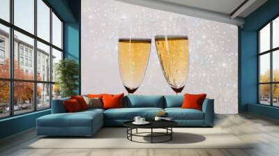 New Years eve concept with bokeh, fireworks and glasses of champagne.  Wall mural