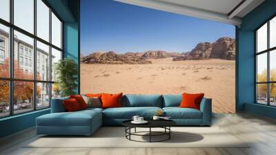 A beautiful day in the Jordanian desert of Wadi Rum. wide dessert with an amazing mountains and sand dunes , amazing scenery that you should see !  Wall mural