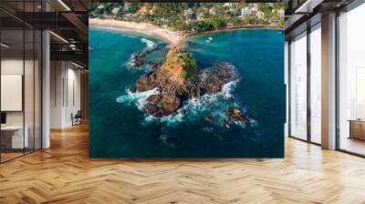 Aerial drone of Mirissa Beach at sunset golden hour. Parrot Rock with waves on sandy beach. Mirissa, Sri Lanka Wall mural