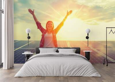 Joyful woman celebrating success and renewable energy under a beautiful sunset, symbolizing optimism, empowerment, and a sustainable future, Generative AI Wall mural