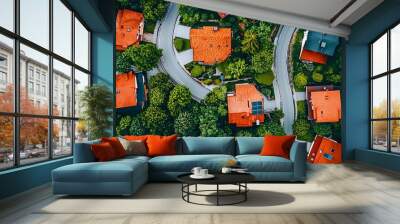 Aerial view of quaint suburban homes with red rooftops surrounded by lush green trees. Wall mural