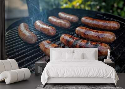 Grilling sausages over hot coals on a sunny day. Wall mural