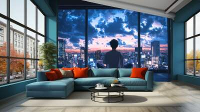 Silhouette of a young man meditating by a city skyline at sunset. Wall mural