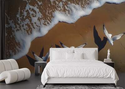 Three seagulls take flight above the shoreline, capturing the essence of freedom. Wall mural