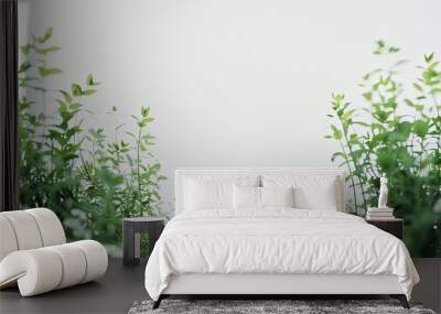 Out of Focus Green Plants Framing the Bottom Sides of a Pure White Background. Blurred Vegetation Creating a Soft Natural Border in a Minimalistic Composition. Wall mural