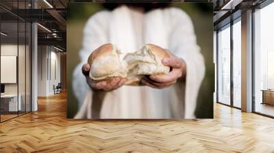 Closeup shot of Jesus Christ splitting the bread with a blurred background Wall mural