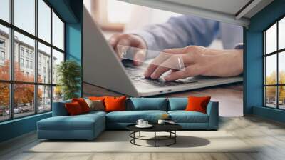 (SEO) Search engine optimization. Businessman working with laptop computer show icon search engine bar in home. Concept work from home. Searching browsing Internet data information. . Wall mural