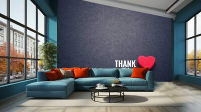 The words thank you and the red heart on the black paper background. Wall mural