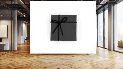 Top view, black gift box tied with a bow isolated on white background. Gift box concept for a happy birthday, thank you, congratulation, mother's day, anniversary, Valentine's Day, or other holidays.. Wall mural