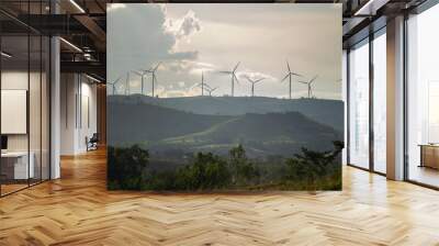 Group of windmills for renewable electric energy production. Wind turbines farm on mountains in rural areas. The clean energy system in Khao Kho District, Phetchabun, Thailand, Southeast Asia. Wall mural