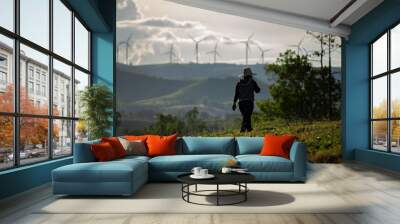 Group of windmills for renewable electric energy production. Wind turbines farm on mountains in rural areas. The clean energy system in Khao Kho District, Phetchabun, Thailand, Southeast Asia. Wall mural