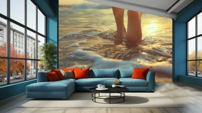 Feet Walking in the Ocean at Sunset. Wall mural