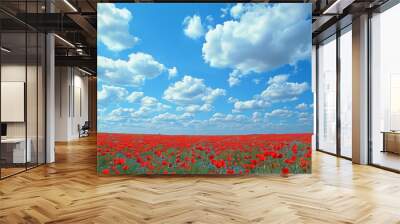 Field of poppies in full bloom, creating a sea of red Blue sky with fluffy white clouds Wall mural