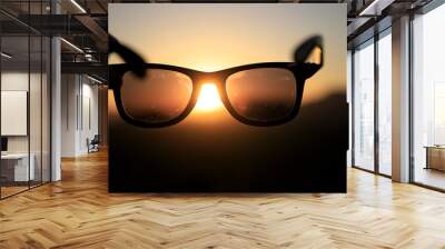 Colorful sunset through a pair of sunglasses Wall mural