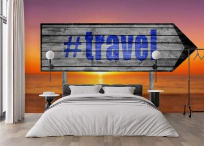 The word with hashtag TRAVEL wooden sign with on a beach backgro Wall mural