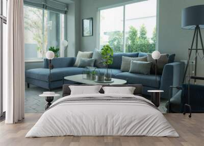 Modern and stylish living room, blue sofa and grey pillow with coffee table and floor lamp. Wall mural