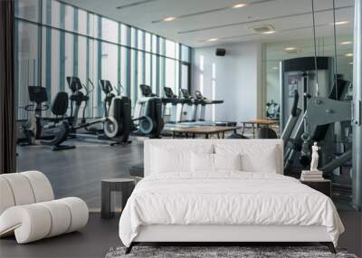 View of fitness room with many exercise equipment installed Wall mural