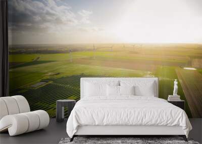 Wind turbines and solar panels farm in a field. Renewable green energy. Sunny landscape, electric energy generator for clean energy producing concept. Wall mural