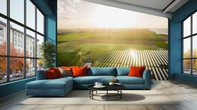 Wind turbines and solar panels farm in a field. Renewable green energy. Sunny landscape, electric energy generator for clean energy producing concept. Wall mural